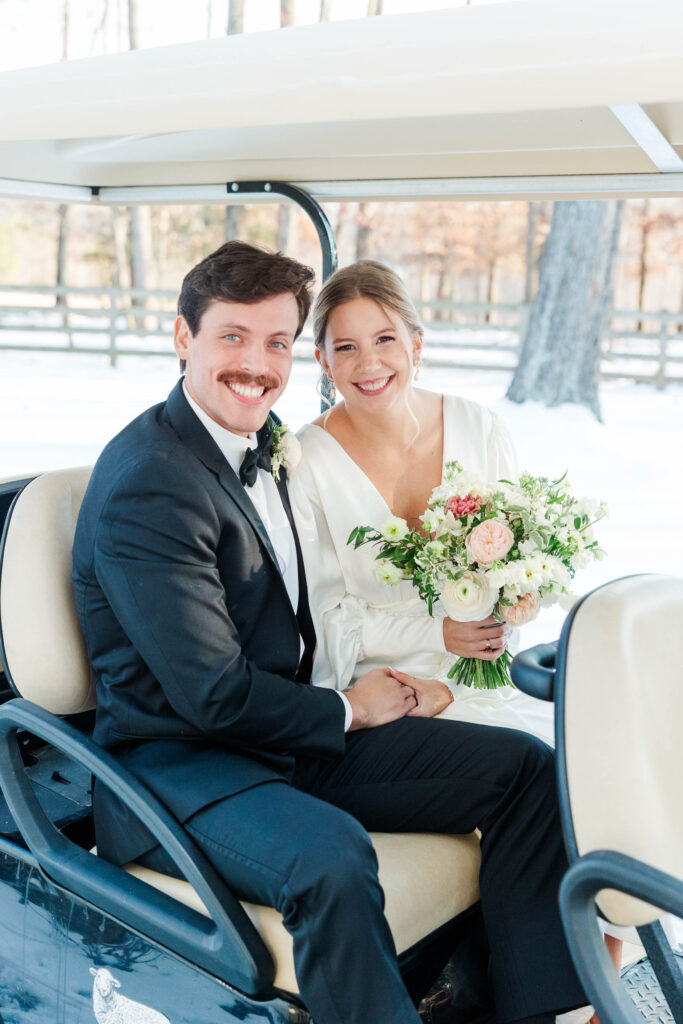 bride and groom on golfcart