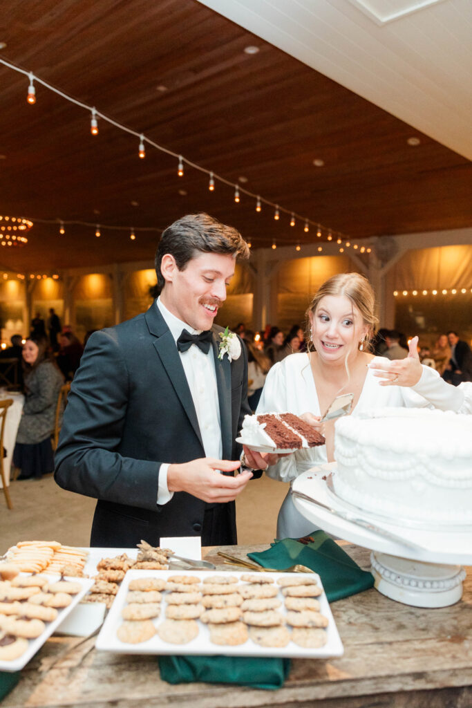 bride and groom cutting the cake 