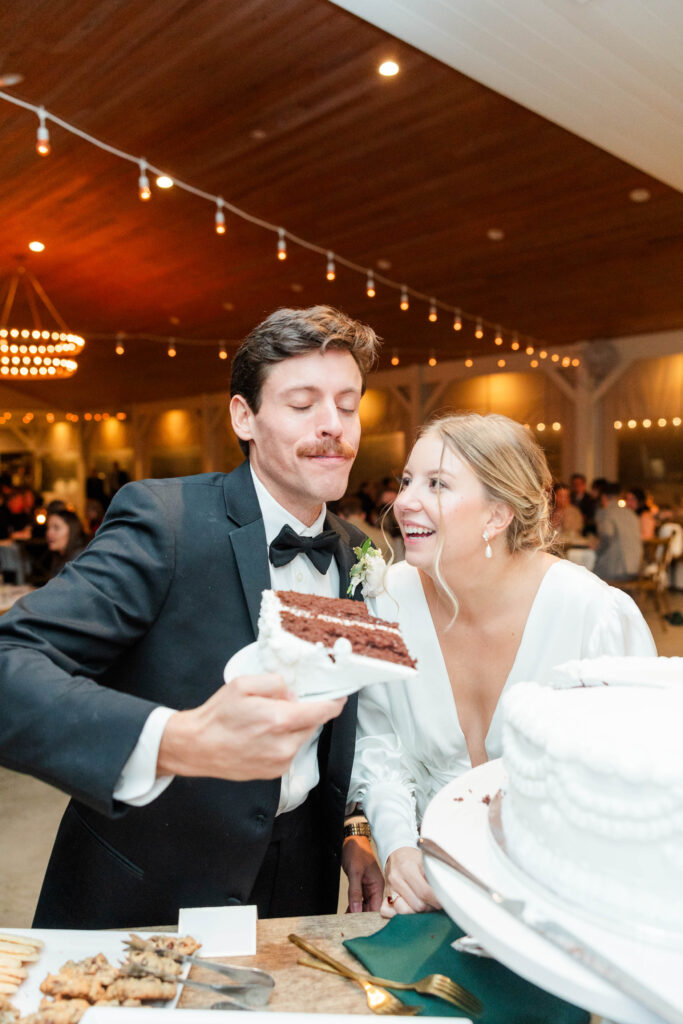 bride and groom cutting the cake 