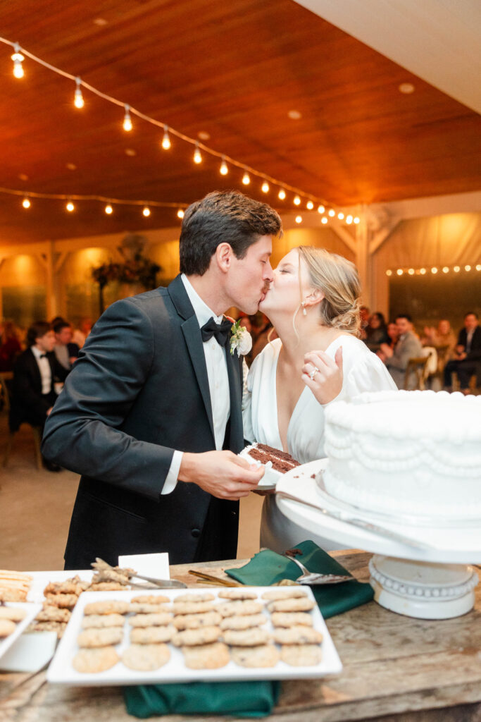 bride and groom cutting the cake 