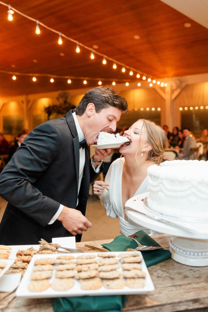 bride and groom cutting the cake 